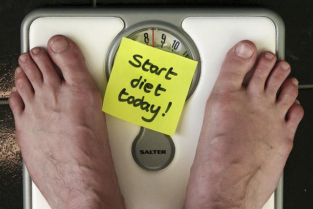 person stepping on the scale