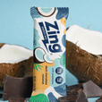 Zing energy bar with dark chocolate and coconut flavor packaging, surrounded by coconuts and chocolate pieces on a light blue background.